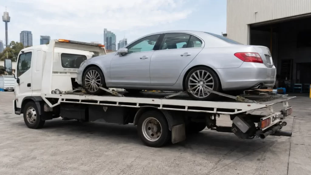 Car secured on flatbed truck
