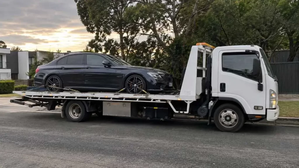Tow truck carrying car